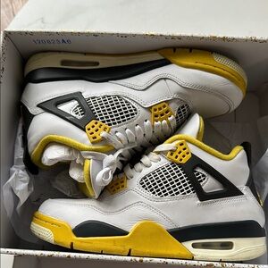 Nike White and Yellow Sneakers with Iconic Design